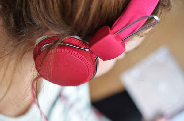 person woman headphones music pink